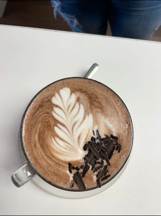 A cup of coffee with chocolate
sprinkles
